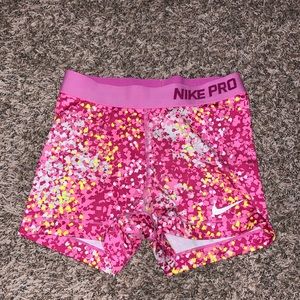 Nike Pros in pink and yellow